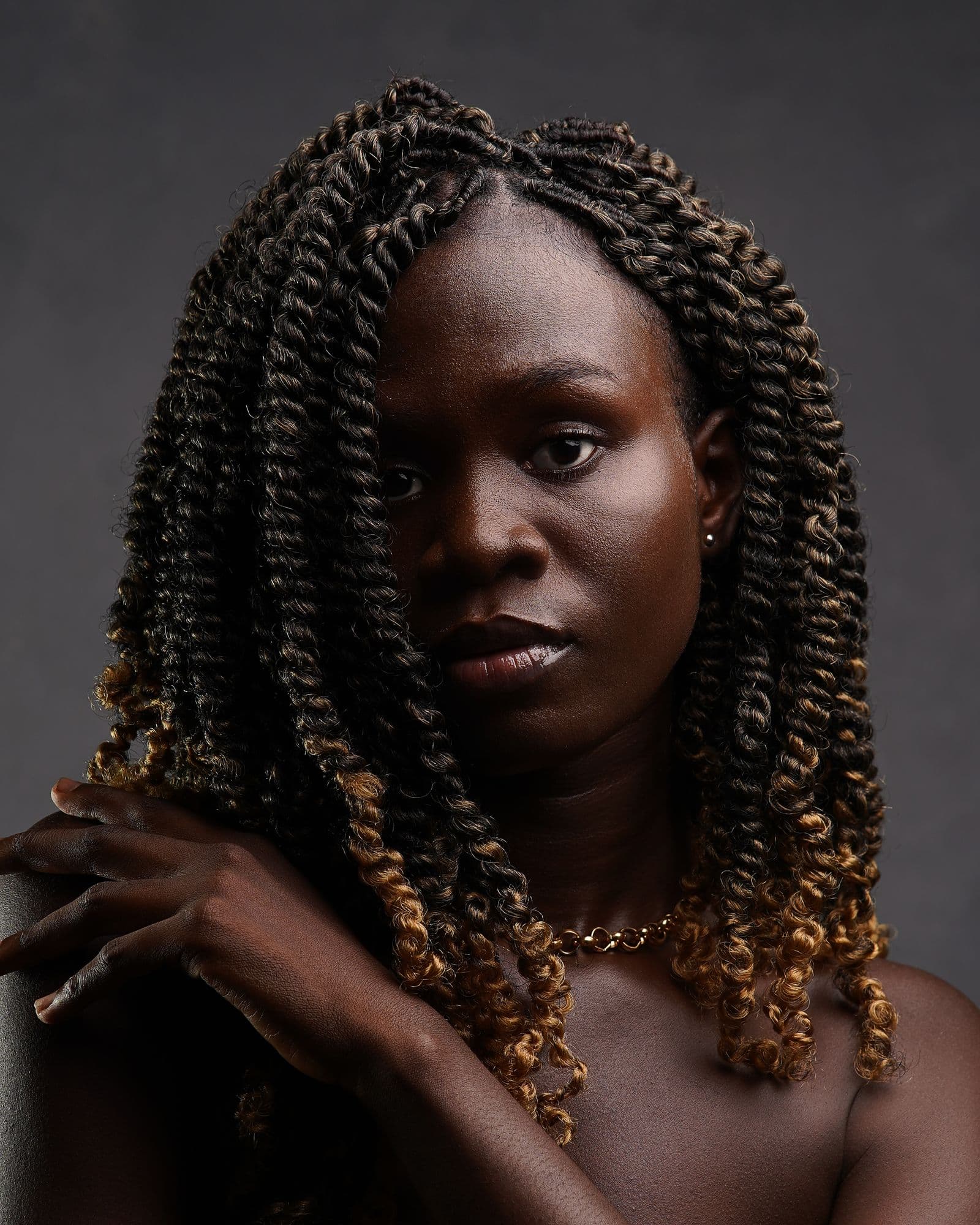 Portrait of a woman with long braided hair, original